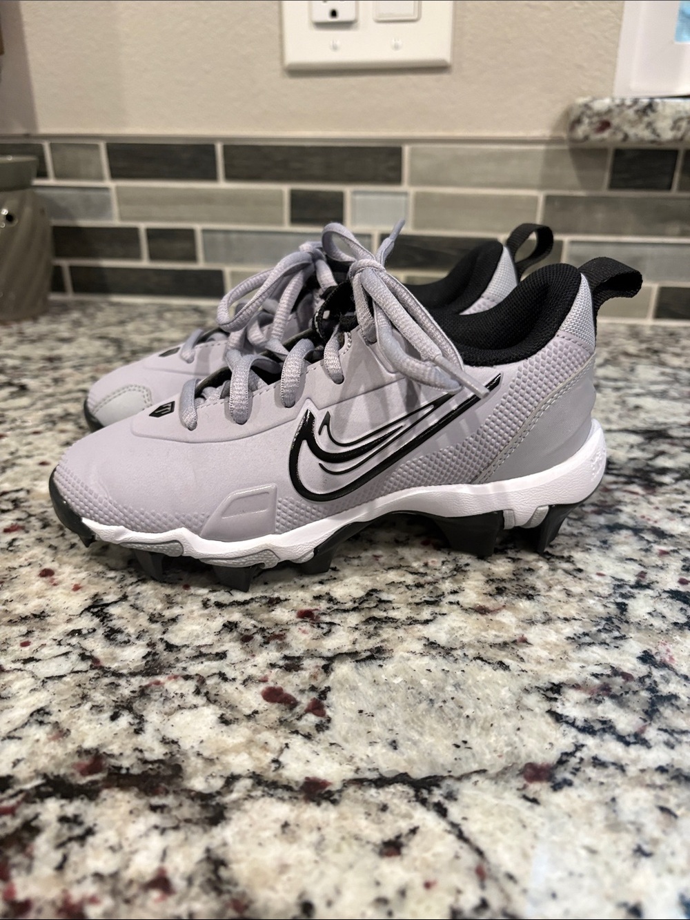 Nike Kids Gray and Black Cleats with Swoosh size 12c